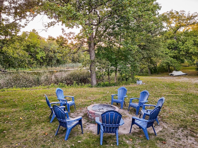 view of yard featuring an outdoor fire pit