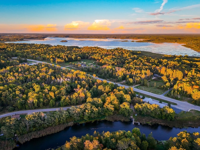 aerial view at dusk with a water view