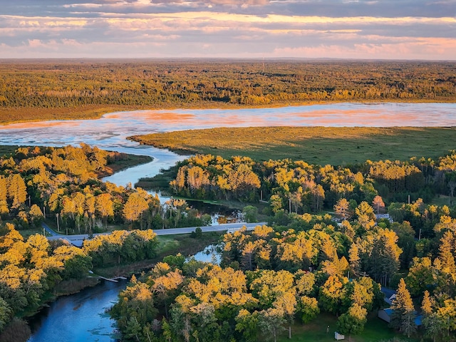 aerial view at dusk with a water view