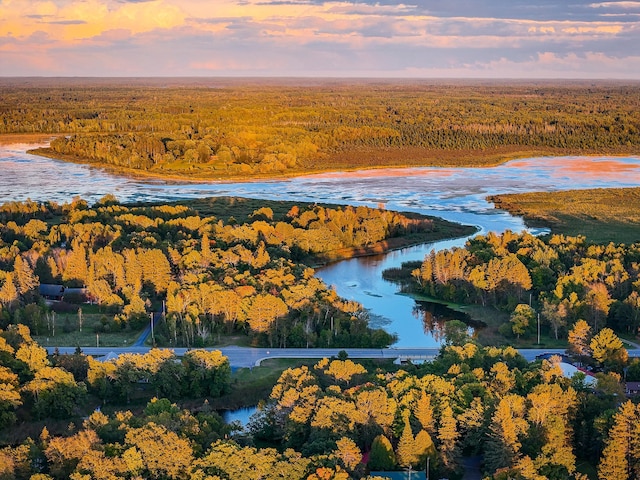 aerial view at dusk with a water view