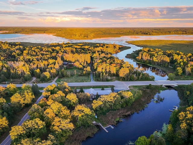 aerial view at dusk with a water view