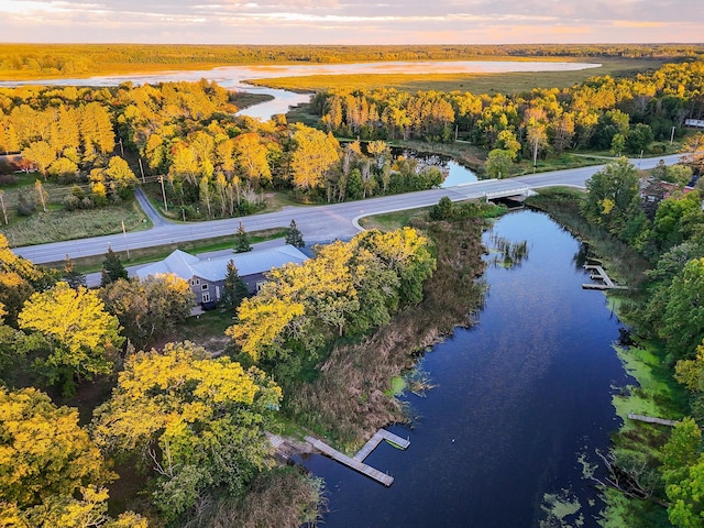 aerial view at dusk with a water view