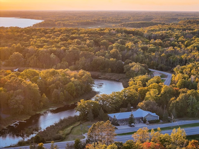 aerial view at dusk with a water view