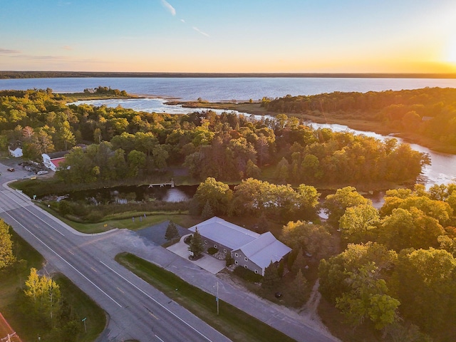 aerial view at dusk with a water view