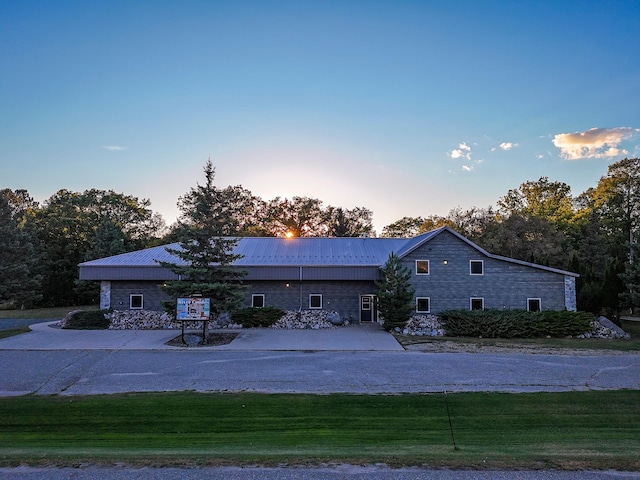 view of front of home with a yard