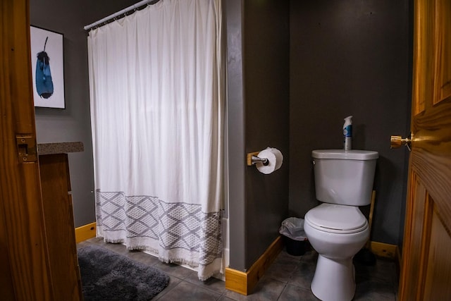 bathroom with tile patterned flooring and toilet