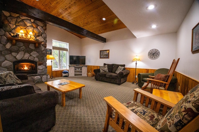 carpeted living room with wooden ceiling, vaulted ceiling with beams, a fireplace, and wooden walls