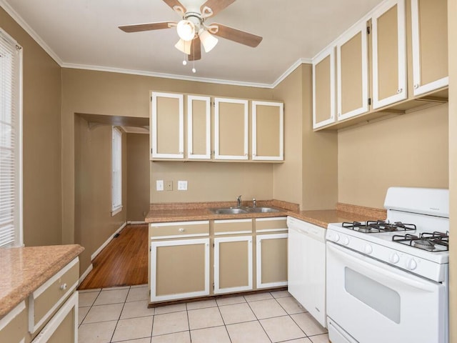 kitchen with ceiling fan, sink, white appliances, light tile patterned floors, and ornamental molding