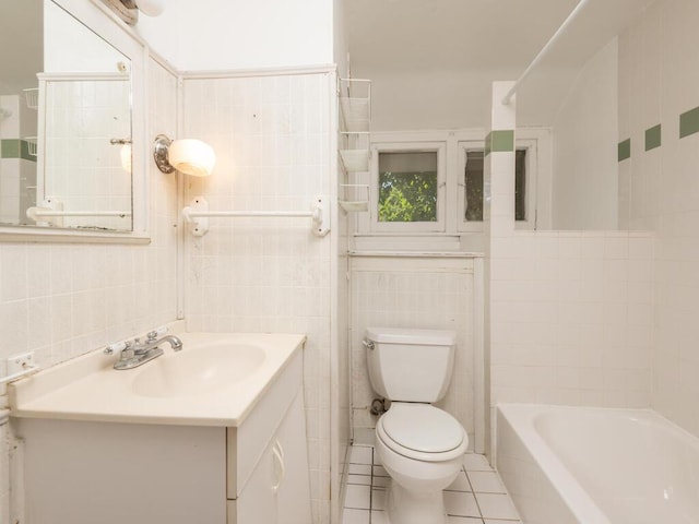 full bathroom featuring tile patterned flooring, vanity, toilet, and tile walls