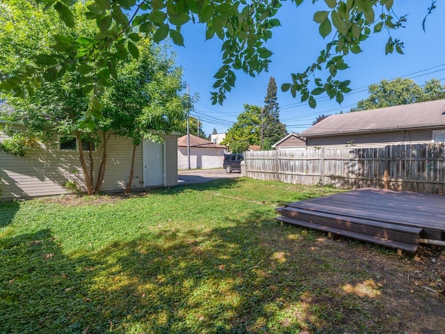 view of yard with a wooden deck