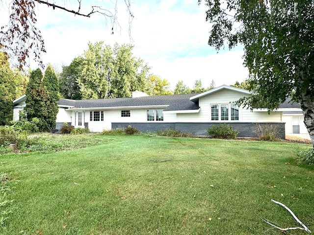 back of house with a lawn