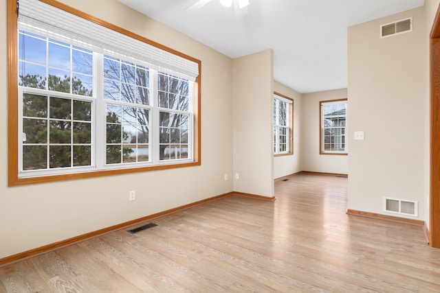 spare room with ceiling fan and light hardwood / wood-style floors