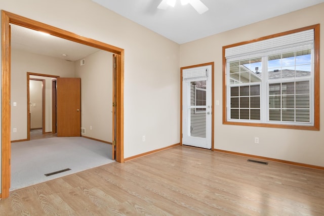 spare room with ceiling fan and light hardwood / wood-style flooring