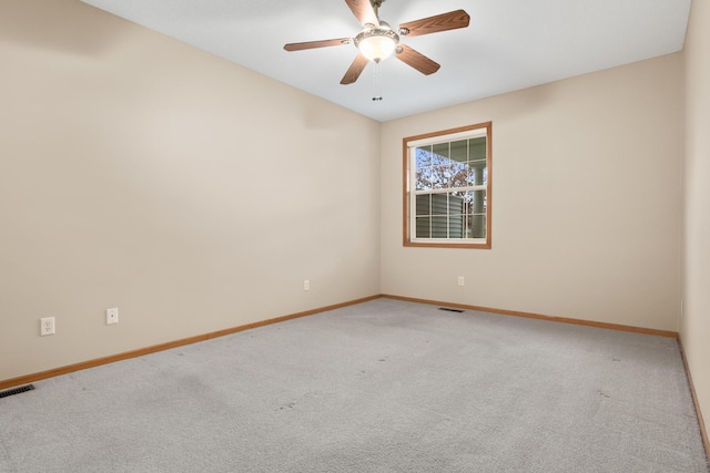 spare room with carpet floors and ceiling fan