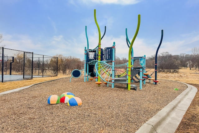 community jungle gym featuring fence