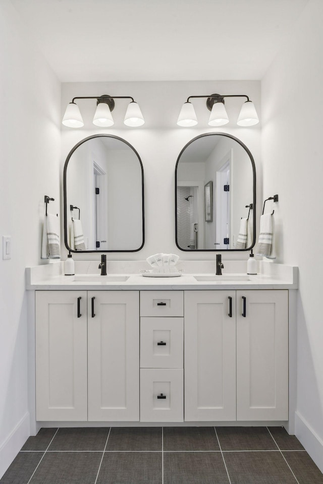 bathroom with tile patterned flooring and vanity