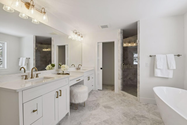 bathroom with vanity and separate shower and tub