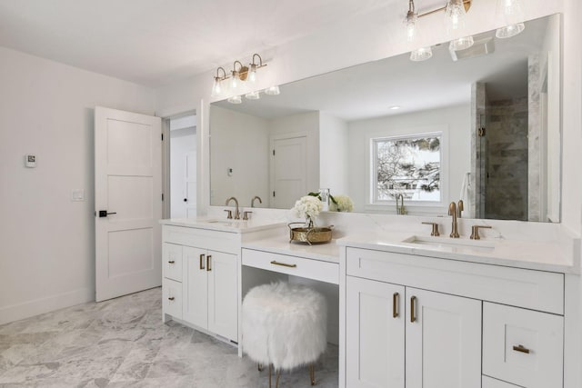 bathroom featuring vanity and a shower with shower door