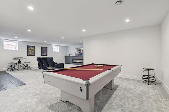 recreation room with pool table and light colored carpet