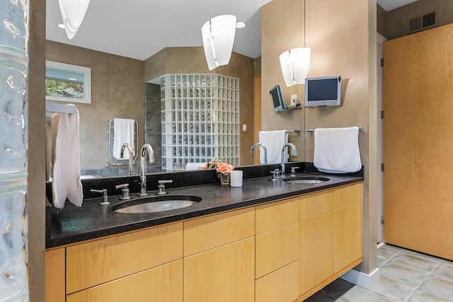 full bath with tile patterned floors, double vanity, a sink, and visible vents