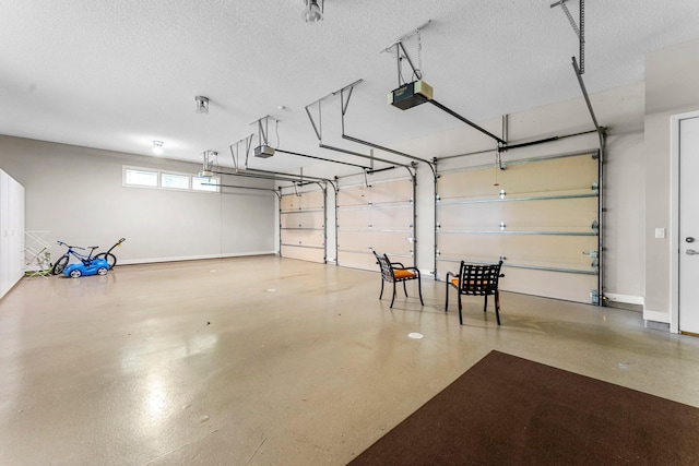 garage featuring baseboards and a garage door opener