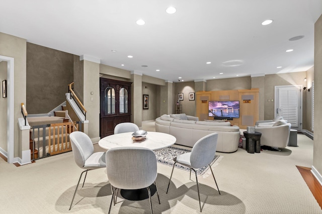 dining space with carpet flooring, stairs, baseboards, and recessed lighting