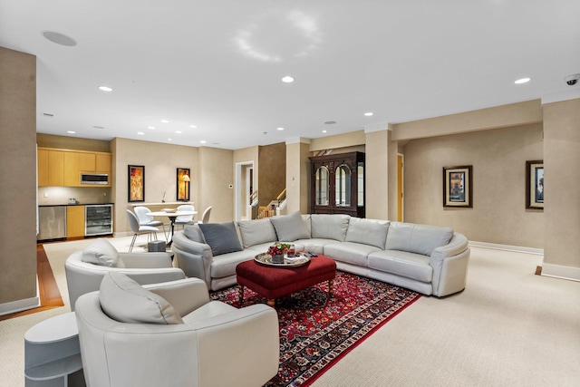 living area with carpet, recessed lighting, beverage cooler, and baseboards