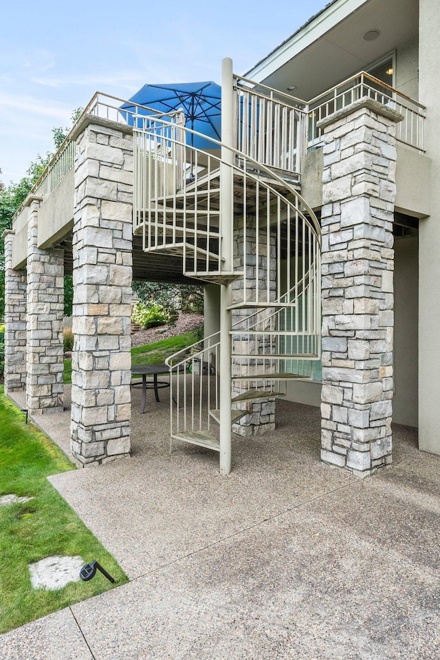 view of patio with stairway