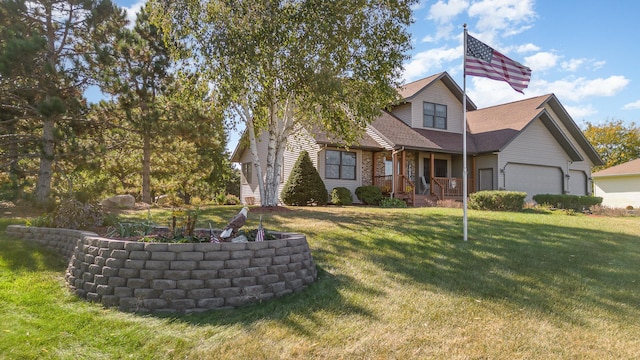 view of front of property featuring a front lawn and a garage