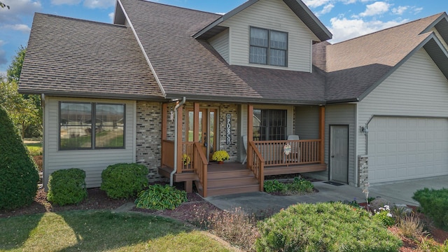 view of front of property with a porch and a garage