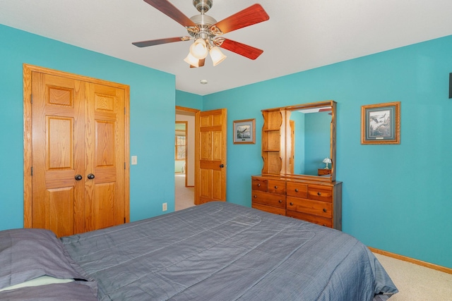 bedroom featuring a closet, carpet flooring, and ceiling fan