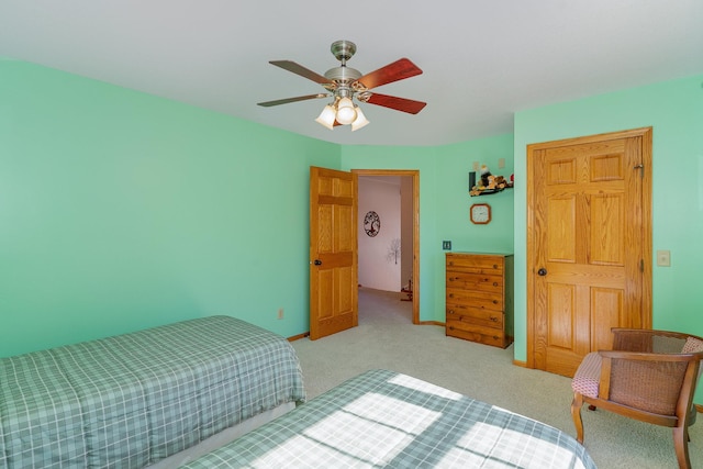 bedroom featuring ceiling fan and light colored carpet