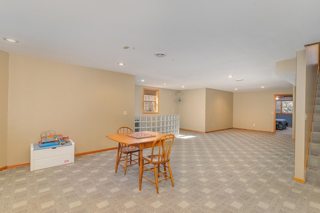 dining room with light carpet