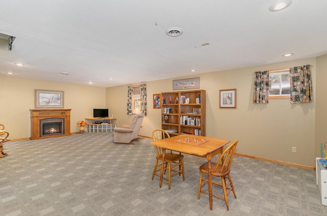 dining room featuring light colored carpet