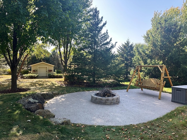 view of patio with an outdoor structure and a garage