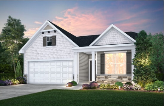 view of front facade with a yard and a garage