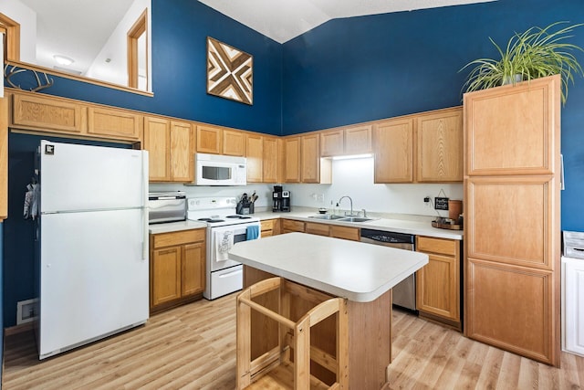 kitchen featuring light hardwood / wood-style floors, sink, white appliances, and high vaulted ceiling