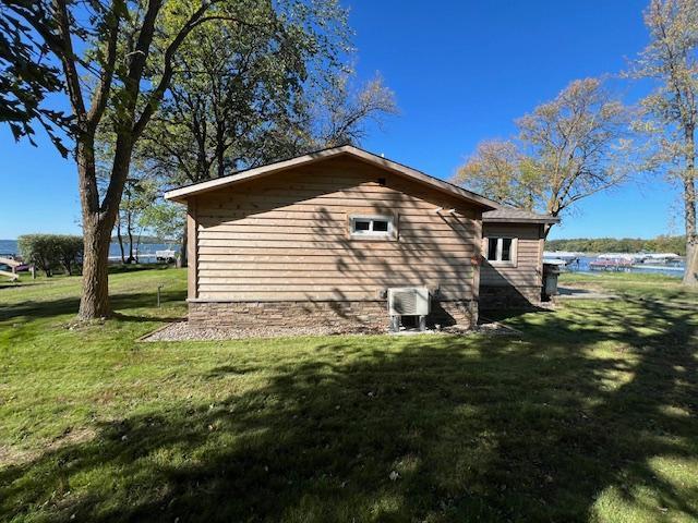 42911 County Highway 53, Pine Lake Twp, MN 56567 - view of home's exterior featuring a lawn