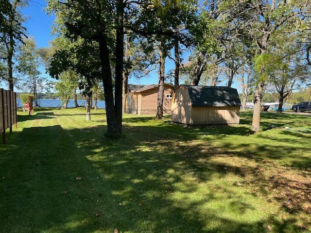 42911 County Highway 53, Pine Lake Twp, MN 56567 - view of green lawn featuring a storage shed and an outdoor structure