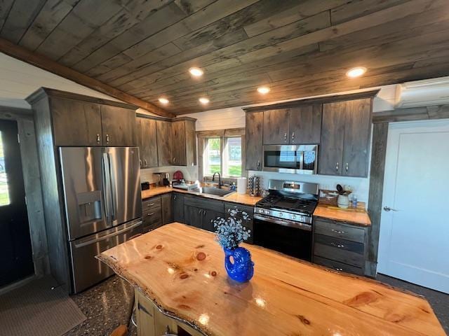 42911 County Highway 53, Pine Lake Twp, MN 56567 - kitchen with appliances with stainless steel finishes, wood ceiling, a sink, butcher block counters, and dark brown cabinets