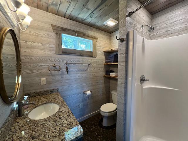 42911 County Highway 53, Pine Lake Twp, MN 56567 - full bath with a shower stall, toilet, wood walls, vanity, and wood ceiling