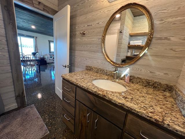 42911 County Highway 53, Pine Lake Twp, MN 56567 - bathroom with wood walls and vanity