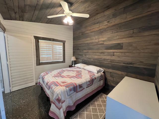 42911 County Highway 53, Pine Lake Twp, MN 56567 - bedroom featuring wood ceiling, wooden walls, and ceiling fan