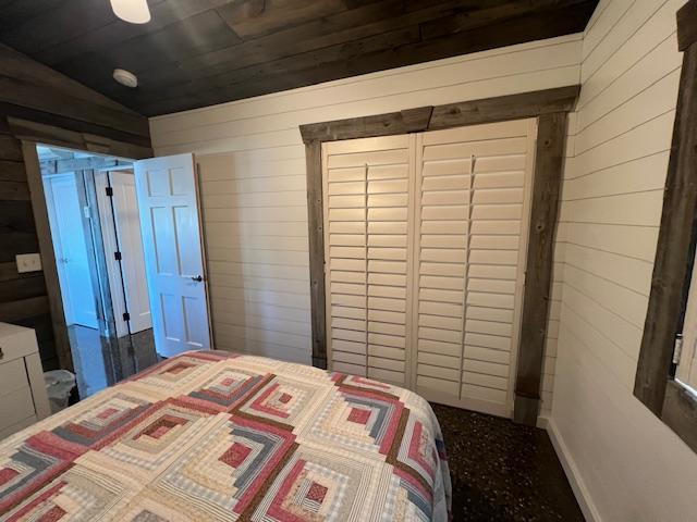 42911 County Highway 53, Pine Lake Twp, MN 56567 - bedroom featuring wooden walls, a closet, wooden ceiling, and vaulted ceiling