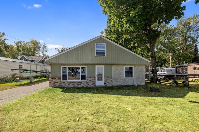 rear view of house with a lawn