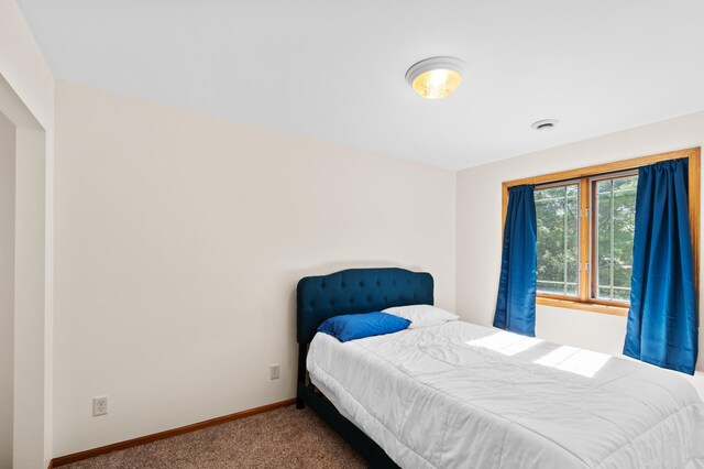 bedroom featuring carpet