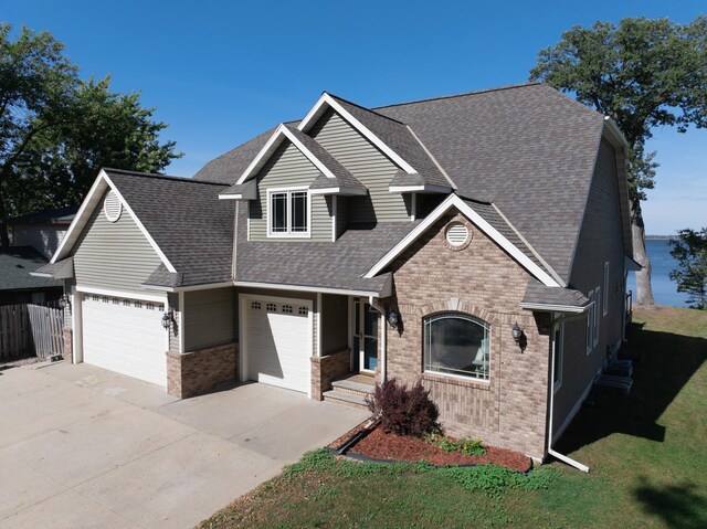 view of front facade with a front yard and a garage