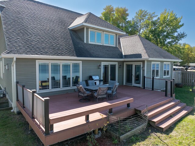 rear view of property featuring a deck