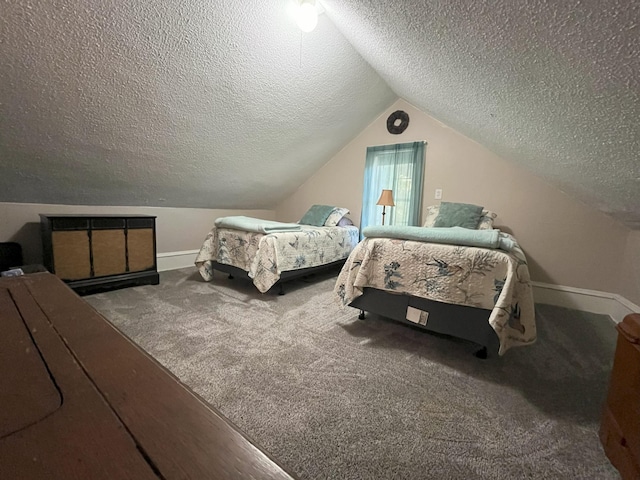 bedroom featuring lofted ceiling, carpet floors, and a textured ceiling