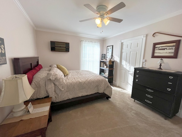 carpeted bedroom with crown molding and ceiling fan